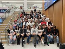 Image of WMSC-FM students sitting on the stairs in the School of Communication and Media