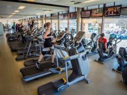 People working out on treadmills and other machines