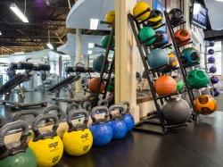 Kettle bells stacked next to a mirror