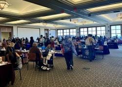 The Conference Center in University Hall is filled with students connecting with admissions representatives.