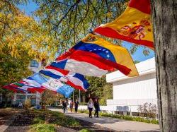 Cultural flags hang in the wind during Hispanic Heritage Month's Celebratory Block Party event.