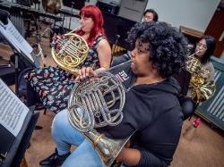 Students practice on their French horns.