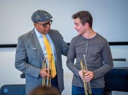 Wynton Marsalis advises a student trumpet player.